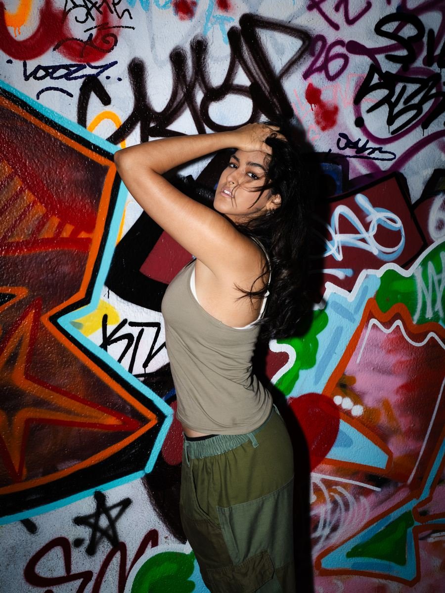 Flash portrait against a graffiti wall.